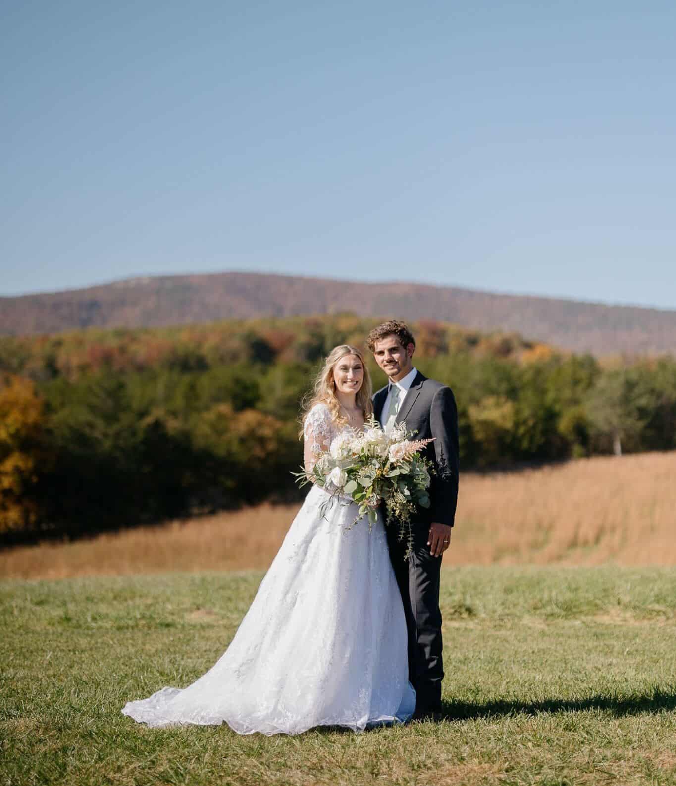 Just married couple celebrating with mountain views at Canaan Springs wedding venue near Winchester, Virginia, a Northern Virginia farm wedding venue with flexible packages and availability