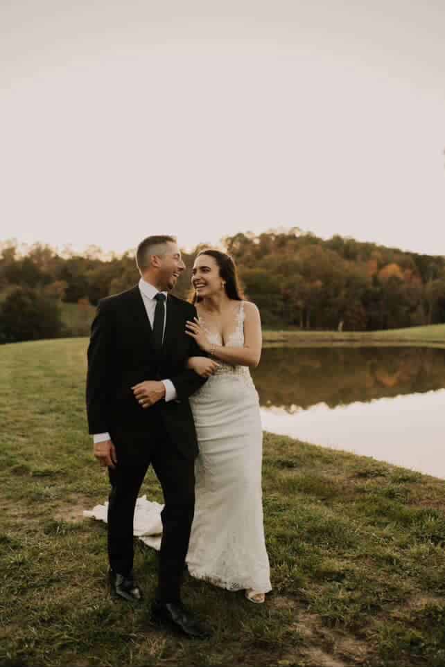 Newly married couple walking the grounds at Canaan Springs wedding venue in Winchester