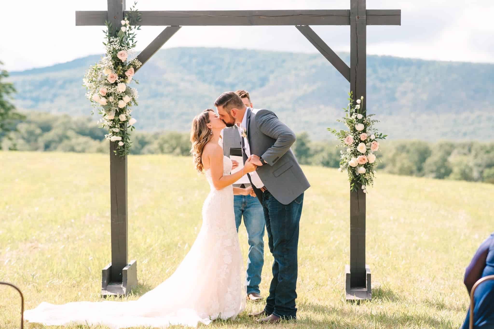 Patio at Canaan Springs wedding venue in Winchester Virginia framed by lampposts with mountain views and fall foliage