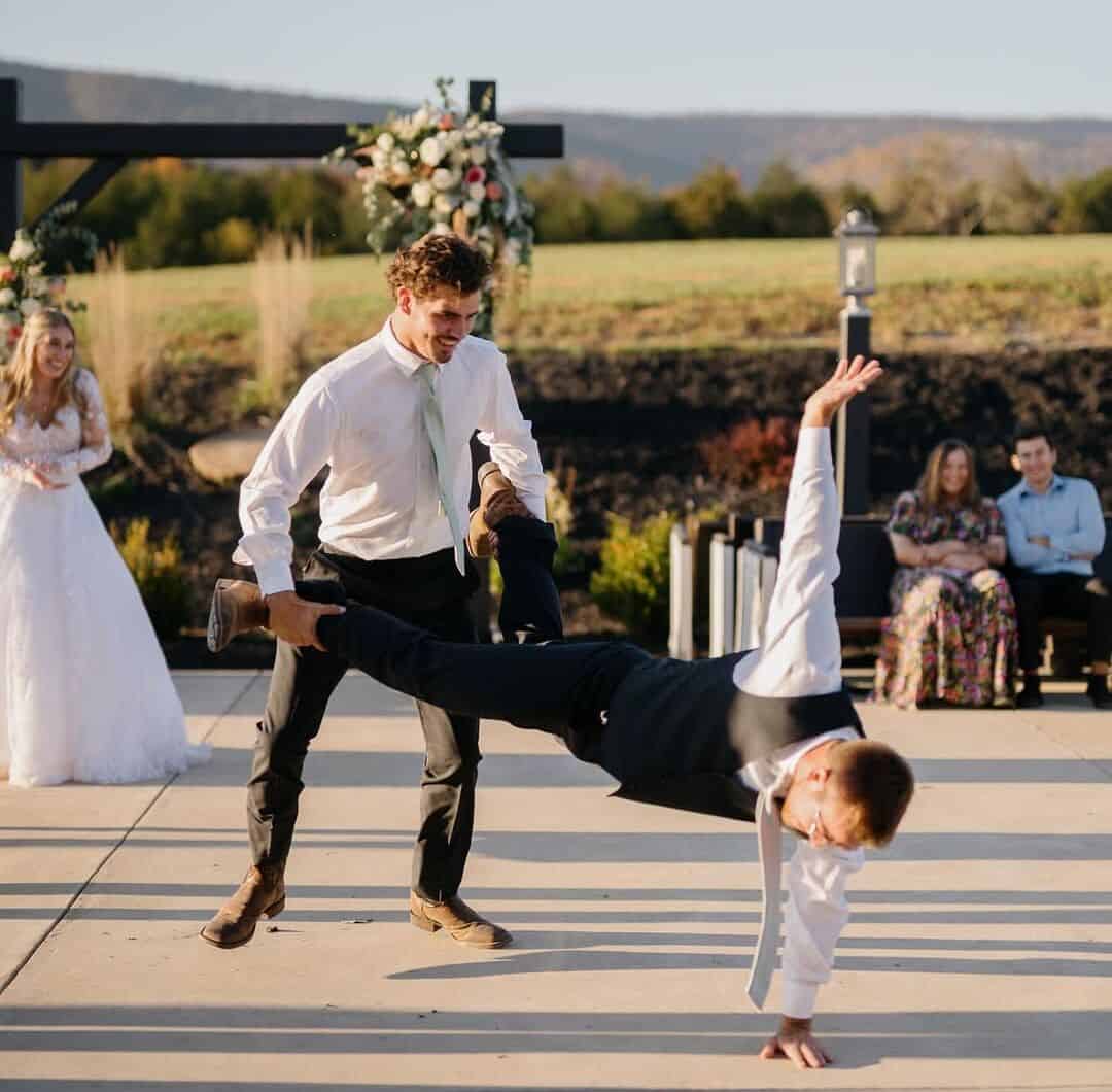 Groom and groomsmen dancing on the outdoor patio during a lively wedding reception at Canaan Springs in Northern VA.