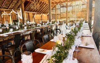 Star Tannery, VA – Canaan Springs wedding venue barn interior showcasing rustic wood architecture, elegant chandeliers, and spacious reception setup in the scenic Shenandoah Valley near Winchester.