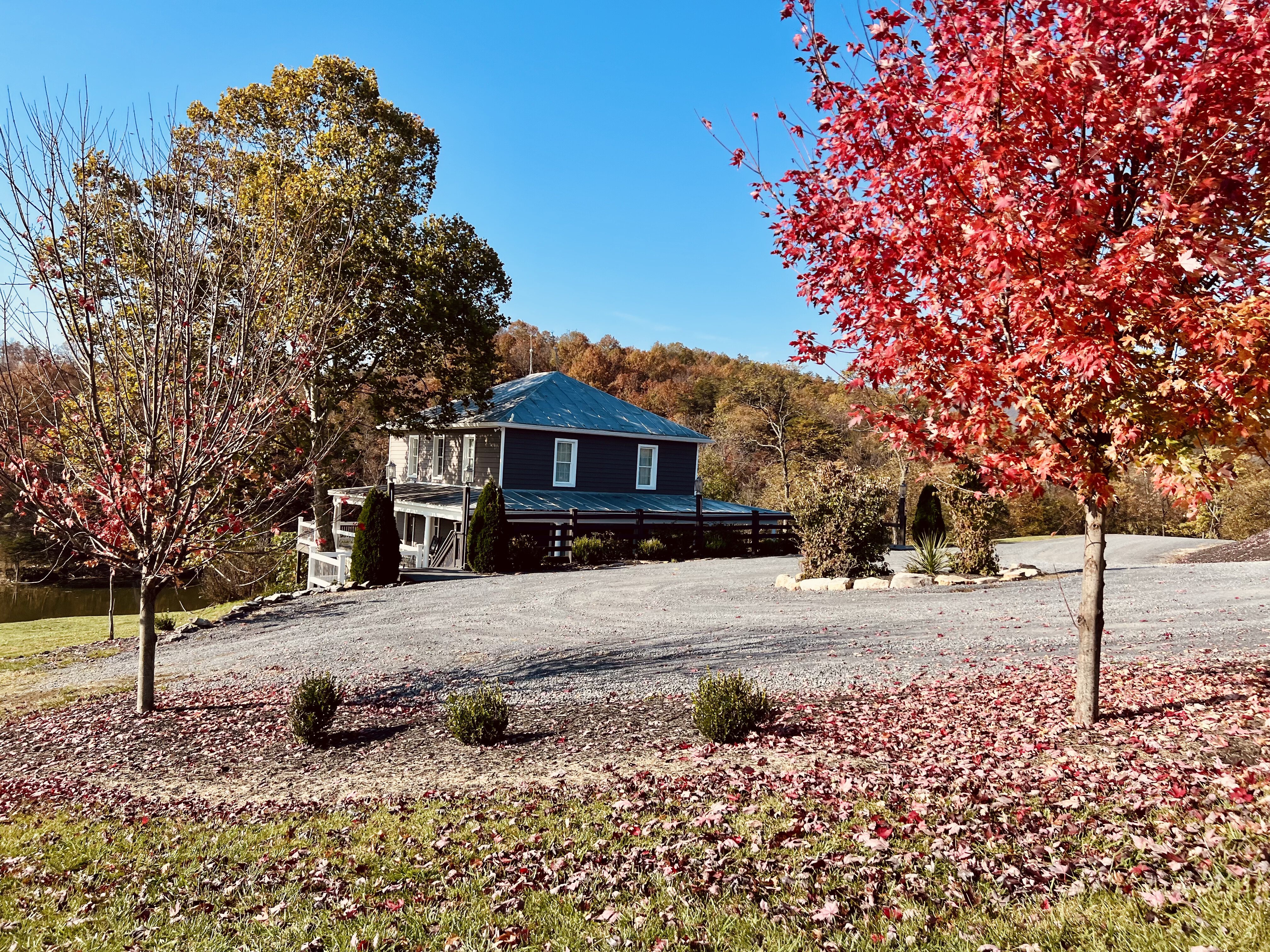 Historic farmhouse at Canaan Springs viewed from the barn in fall, on-site lodging for Northern Virginia wedding weekends near Winchester VA