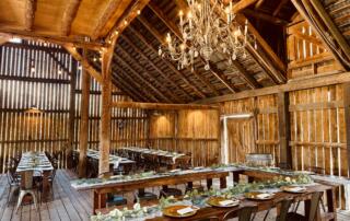 Inside the historic barn at Canaan Springs with chandelier lighting, a Northern Virginia barn wedding venue near Winchester, Virginia