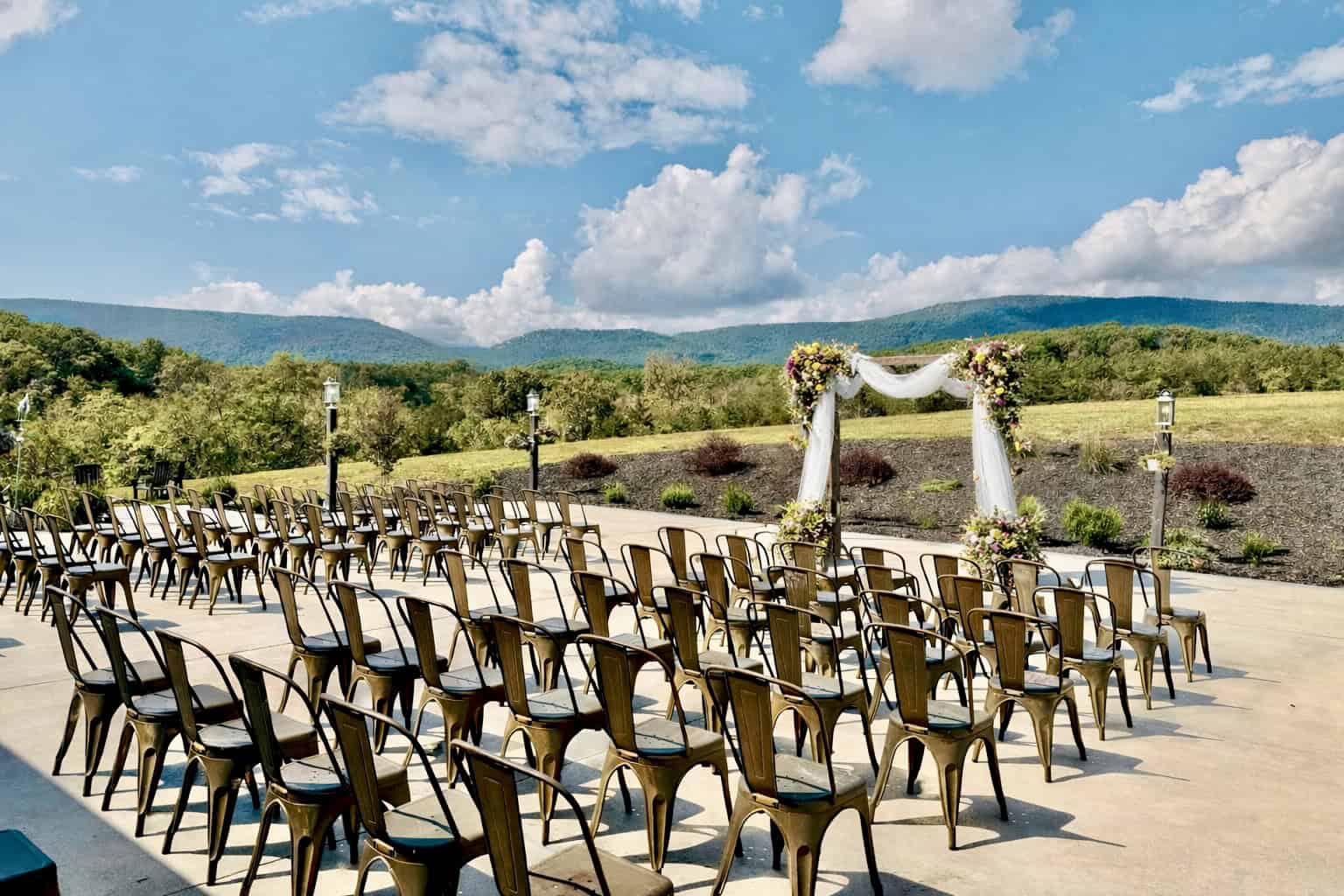 Just married couple at Canaan Springs wedding venue near Winchester, Virginia, celebrating a private farm wedding with mountain views and exclusive venue access